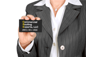 Commercial Roofing Experts CEO with business card